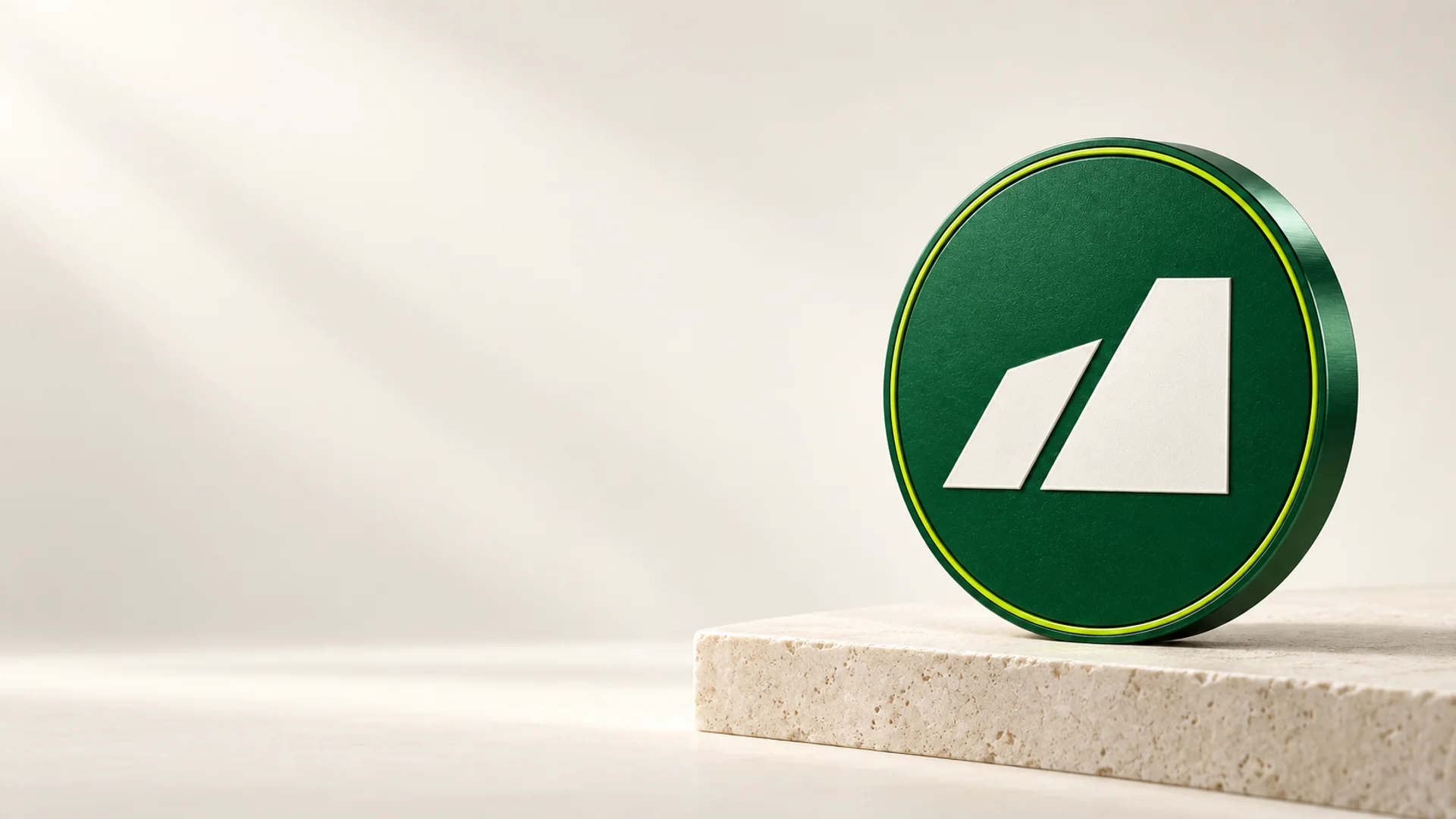 The Talis coin: a forest-green disc with the ivory split mark and a lime ring, standing on a travertine block